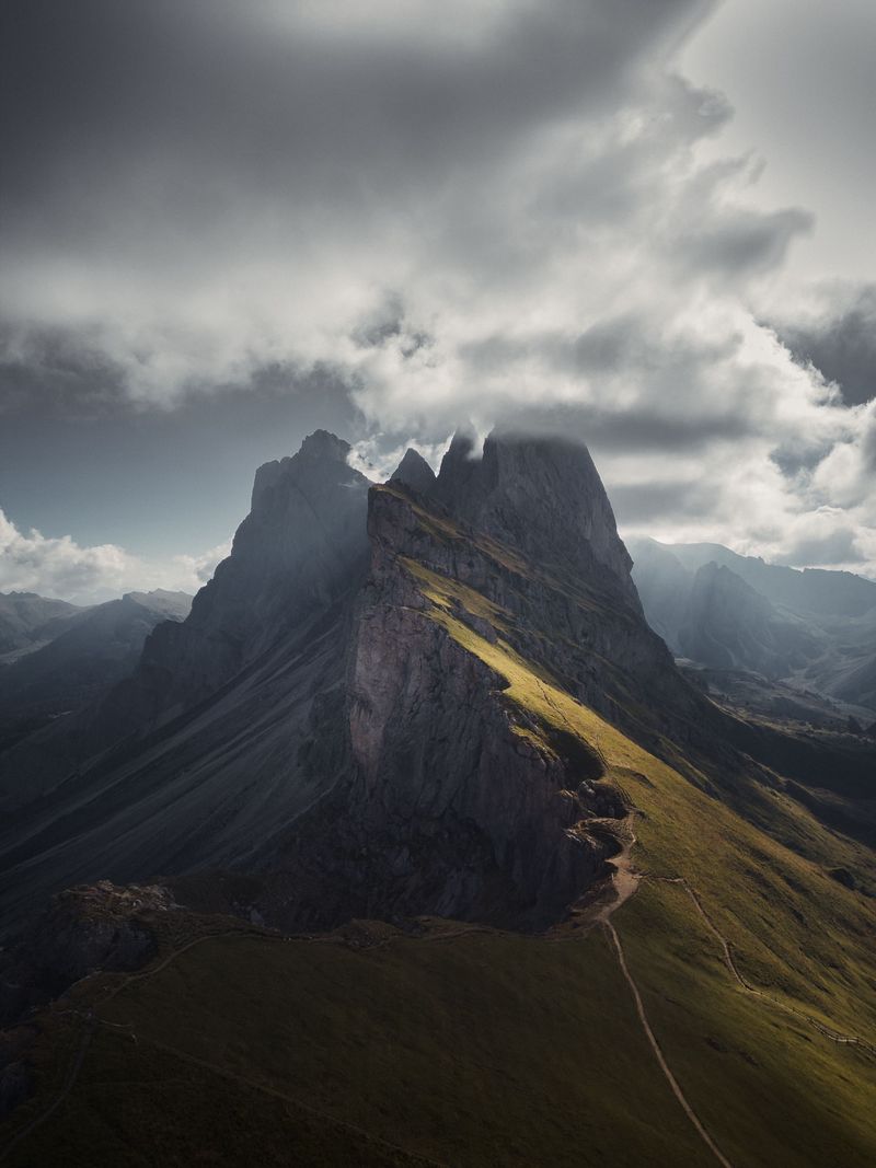 The Seceda ridge in the Dolomites under storm clouds